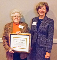 Barbara S. Rivette (left) receives the CNY RPDB's Rhea Eckel Clark Citizenship Award from Board Chairwoman Kathleen A. Rapp at the Board's 2014 Annual Meeting