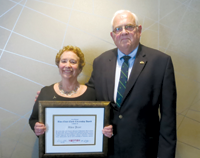 Rhea Jezer (left) receives the CNY RPDB's Rhea Eckel Clark Citizenship Award from Board Chairman James J. Murphy, Jr., at the Board's 2017 Annual Meeting