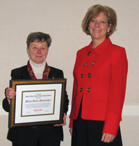 Mary Ann Messinger (left) receives the CNY RPDB's Rhea Eckel Clark Citizenship Award from Board Chairwoman Kathleen A. Rapp at the Board's 2009 Annual Meeting