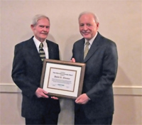 David R. Elleman (left) receives the CNY RPDB's Rhea Eckel Clark Citizenship Award from County Executive Nicholas J. Pirro at the Board's 2007 Annual Meeting
