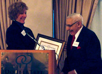 Ferdinand L. Picardi (right) receives the CNY RPDB's Rhea Eckel Clark Citizenship Award from Board Chairwoman Kathleen A. Rapp at the Board's 2008 Annual Meeting
